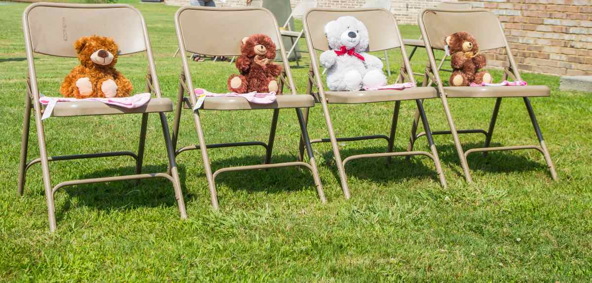Four teddy bears sitting in chairs | Fun Games For Baby Shower That Moms And Guests Will Love