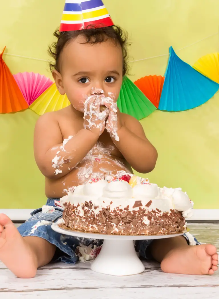 first birthday boy themes boy eating cake